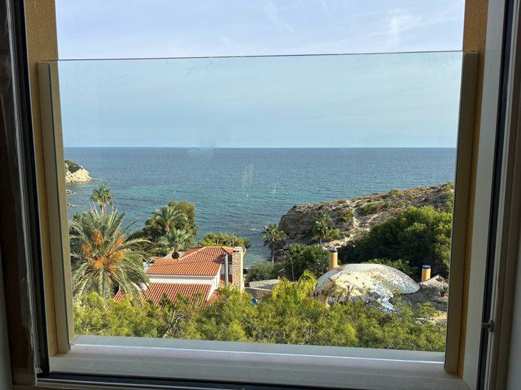 Glass French balcony with sea view