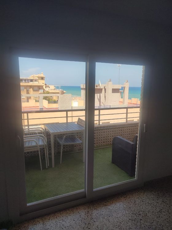 PVC sliding door to a sea-view terrace