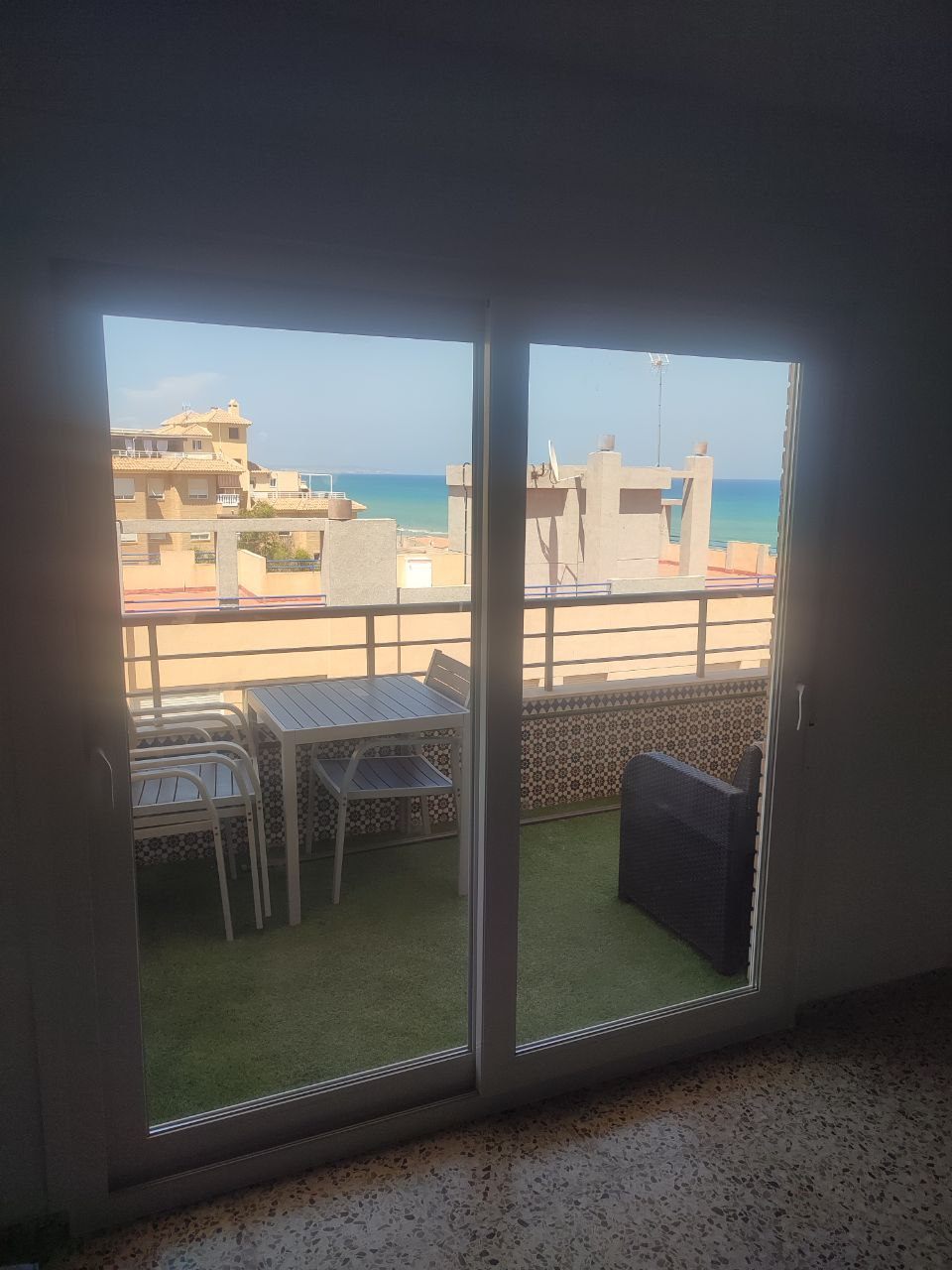 PVC sliding door to a sea-view terrace