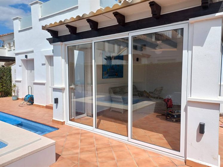 Aluminium sliding doors facing the pool