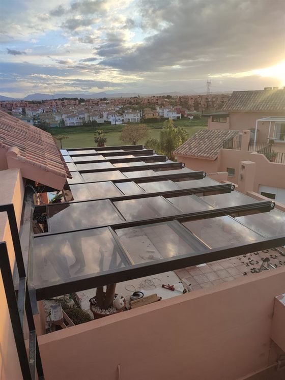 Glass roof on a terrace at sunset